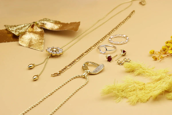 An image featuring curated vs. created jewelry