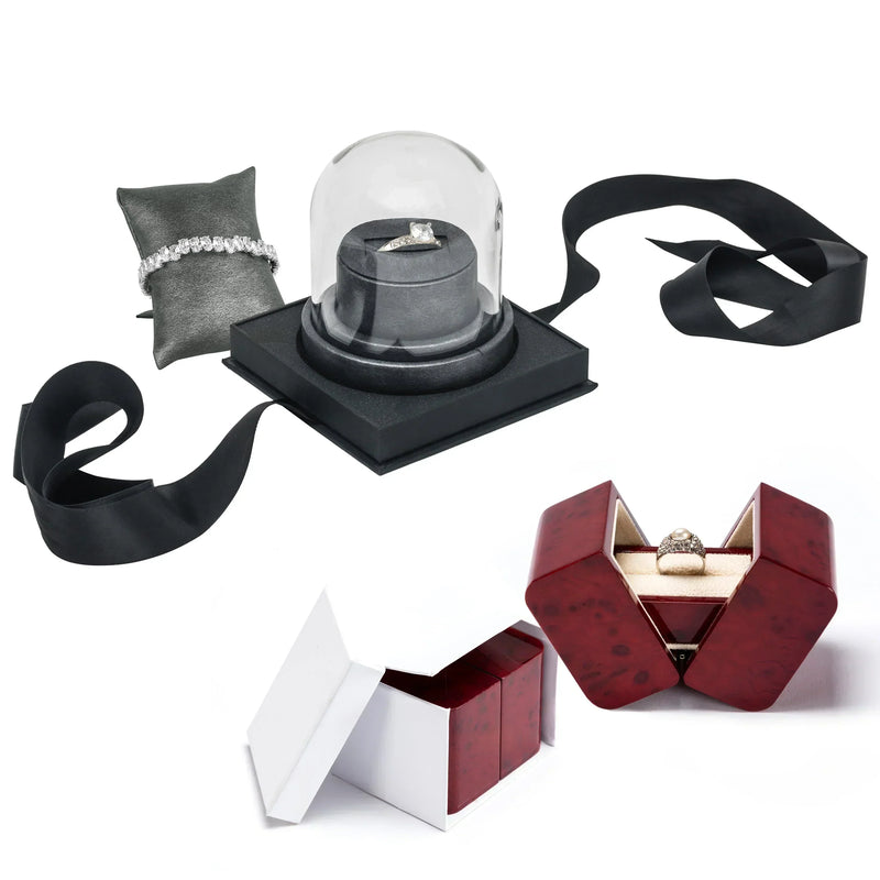Modern jewelry box designs featuring a red lacquered ring box and a glass dome display case, highlighting elegant, contemporary packaging for luxury rings and bracelets